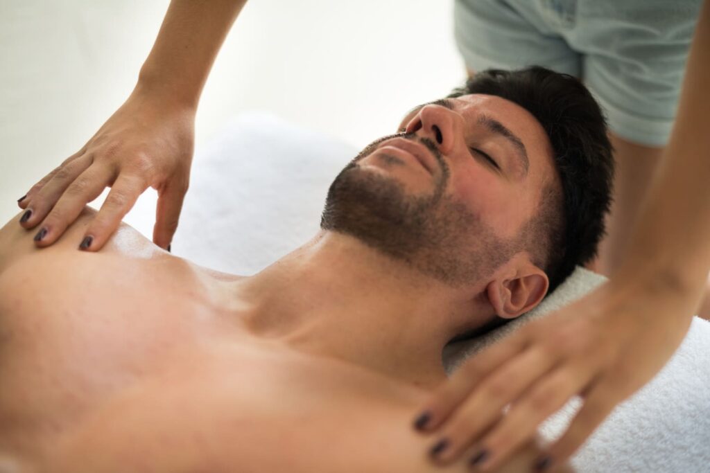 A man getting massaged in a spa